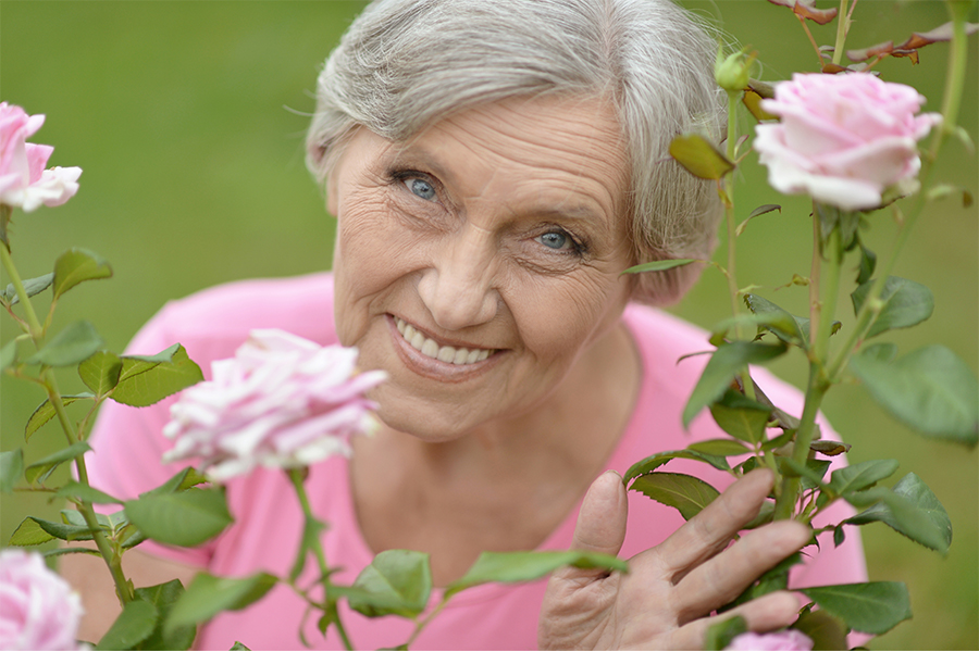 Peaceful woman with pink roses